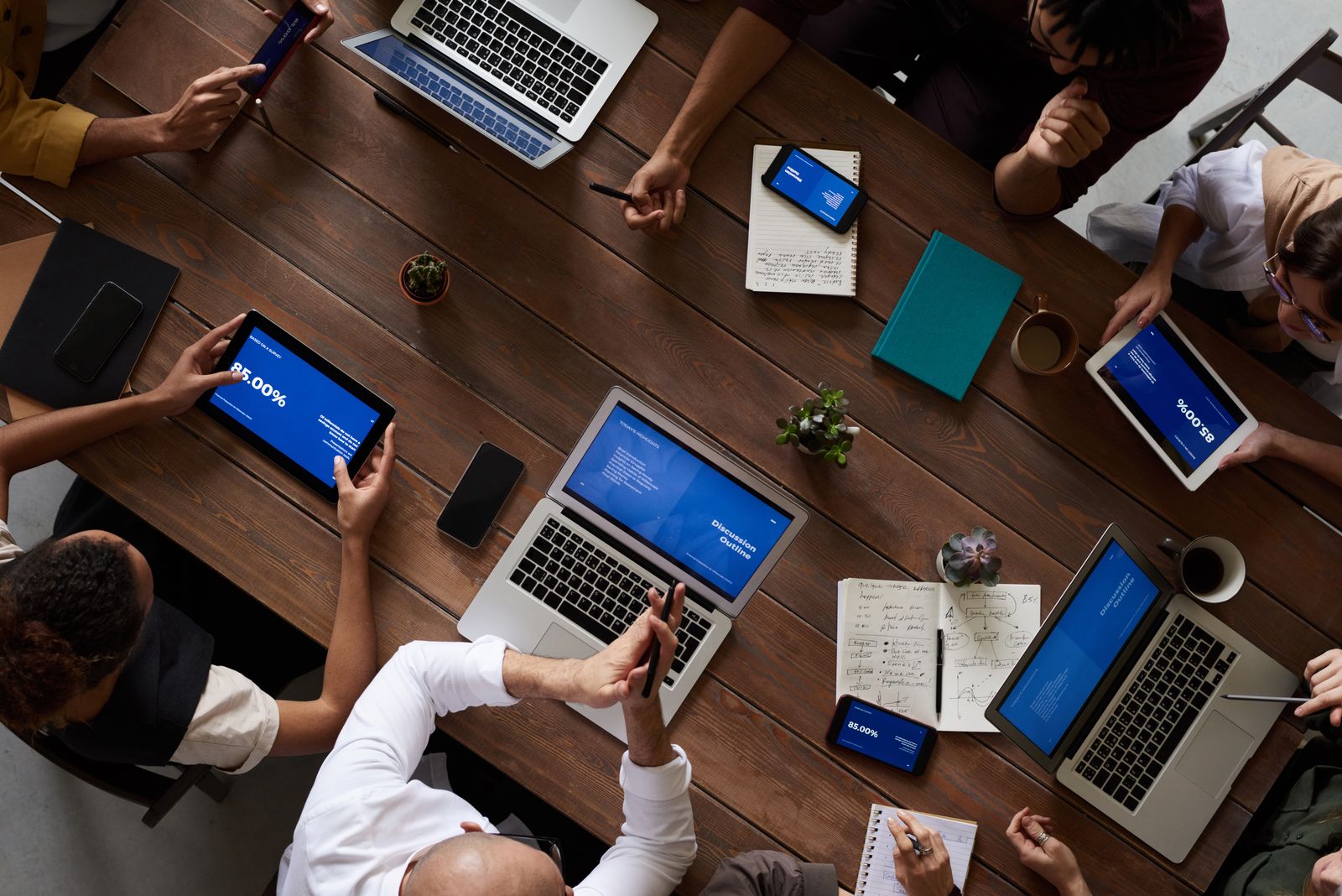 Senior colleagues reviewing strategy together around a meeting table